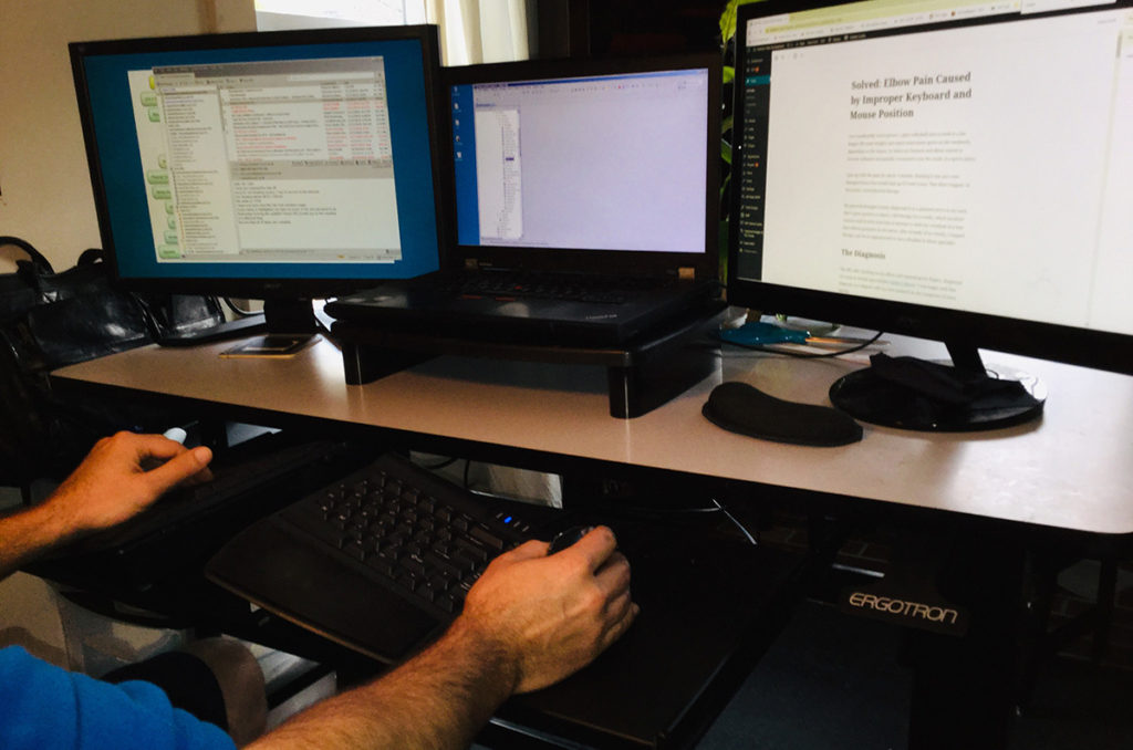 a workstation with tented keyboard and vertical mouse